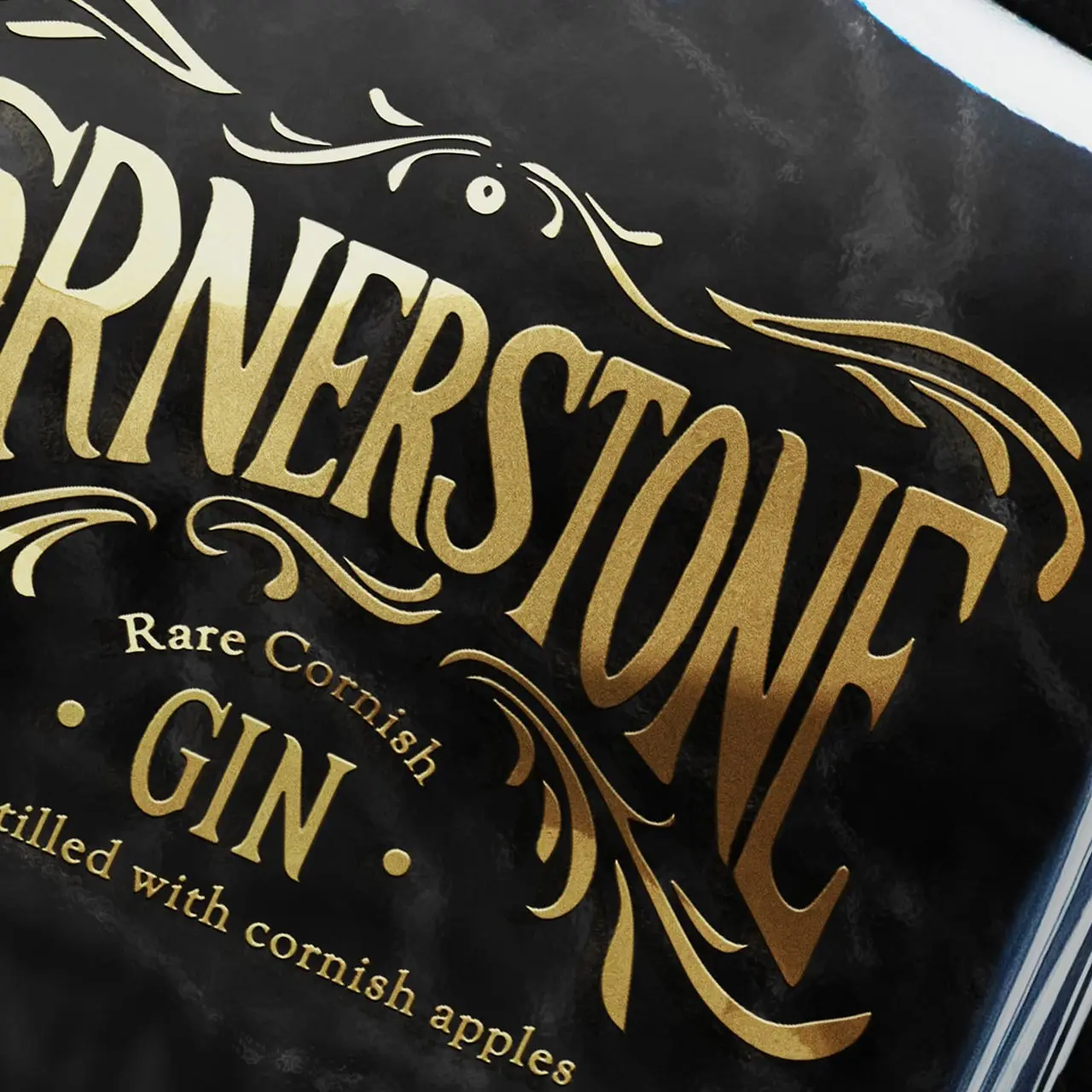 A close-up image of the Cornerstone gin bottle branding