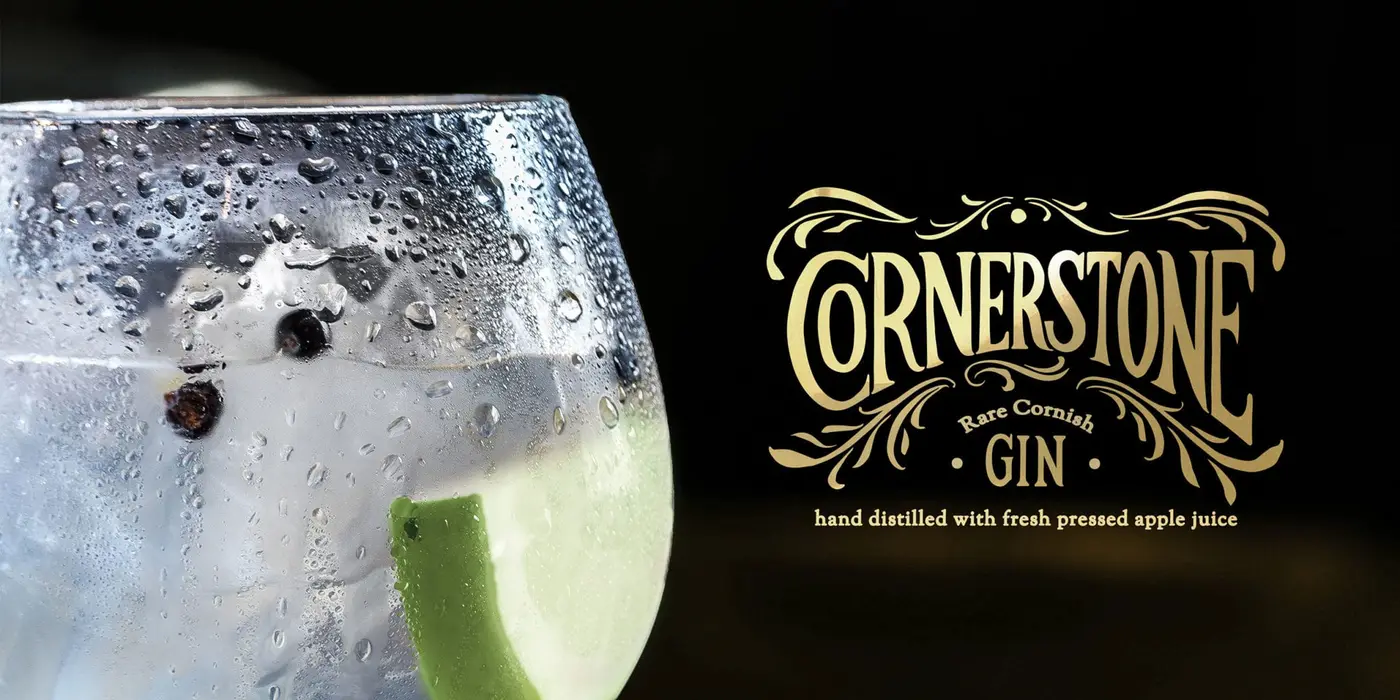 A glass of gin with apple in it along with the Cornerstone gin branding overlaid to the right
