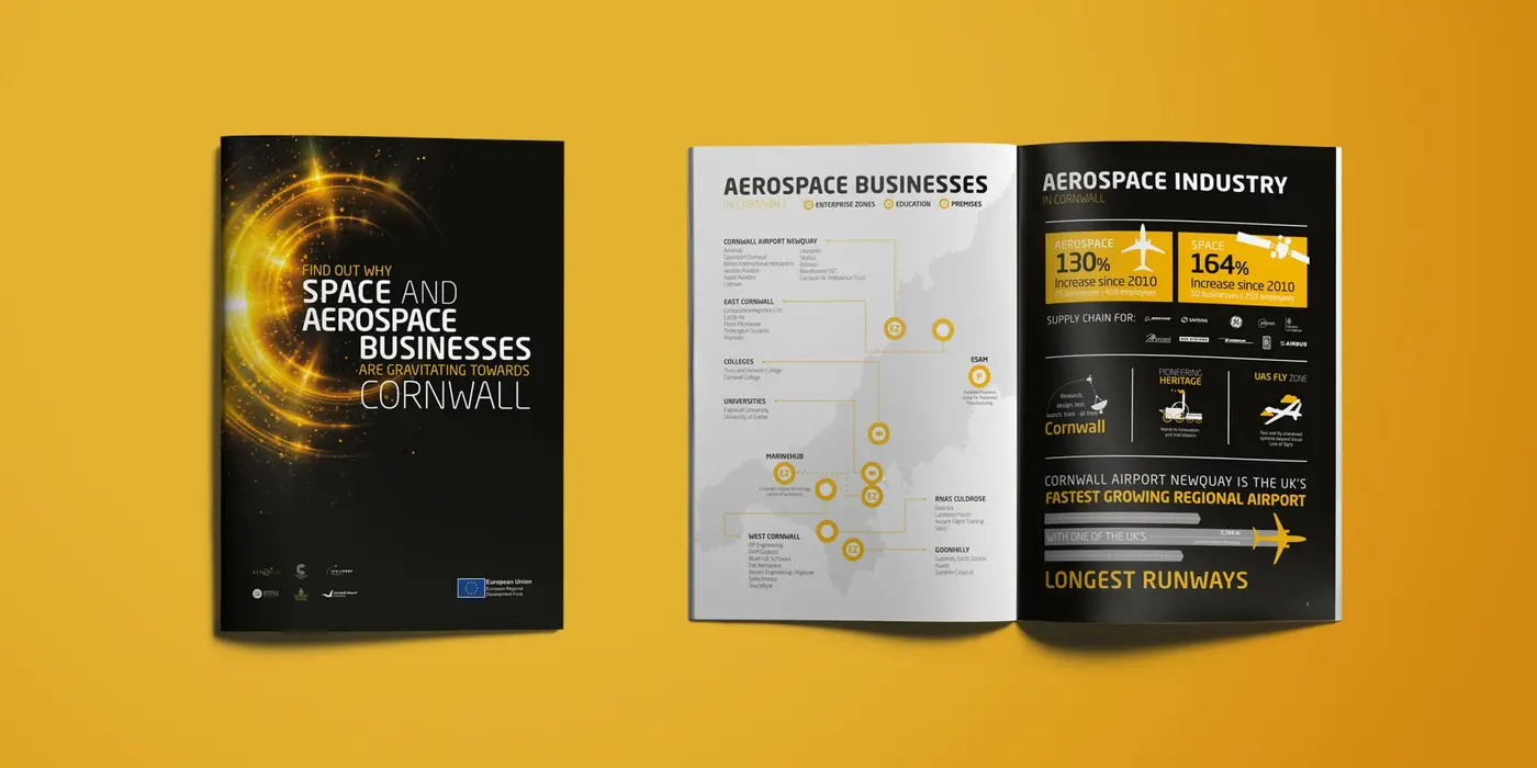 An image of the Aerospace Cornwall branded event brochure design from above. Displaying a double page spread and a front cover design.